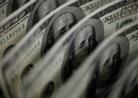 New year but old themes to weigh heavily on the dollar: Reuters poll