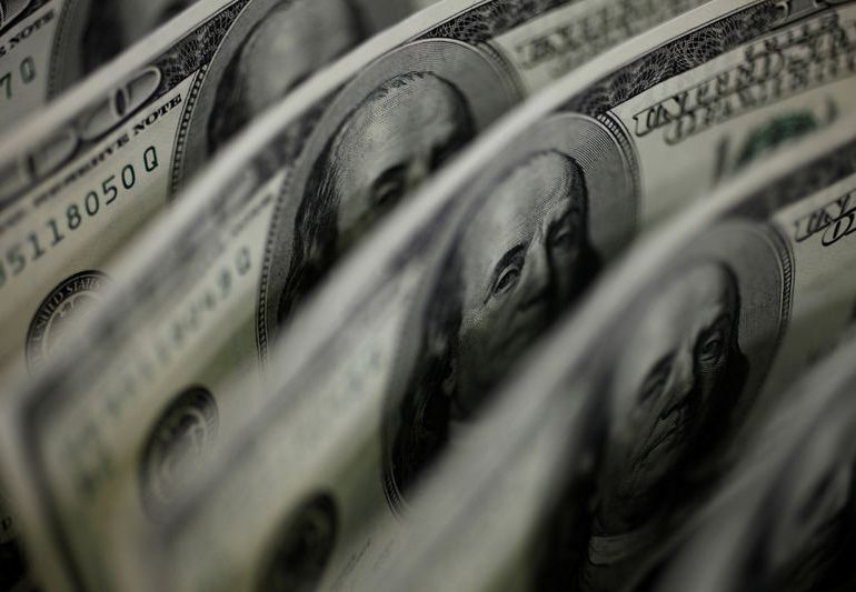 New year but old themes to weigh heavily on the dollar: Reuters poll