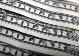 Dollar Largely Flat; Powell Seeks Patience with Accommodative Policies