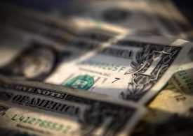 Dollar Edges Lower; Remains Elevated as Yields Rise