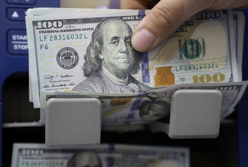 Dollar on back foot as U.S. yields drop despite strengthening U.S. recovery
