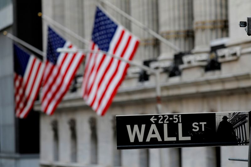 Wall St ends lower as investors await earnings, inflation data