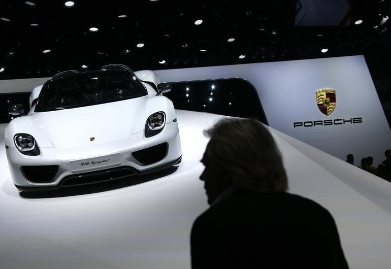 Unveiling its last petrol car, Lotus sets off in pursuit of Porsche By Reuters