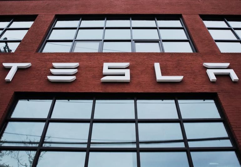 Biden's EV charging push boosts established automakers taking on Tesla By Reuters