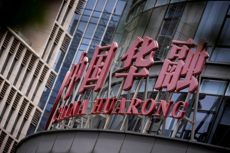 Exclusive-China pushes Huarong to sell non-core units, mulls implicit support - sources