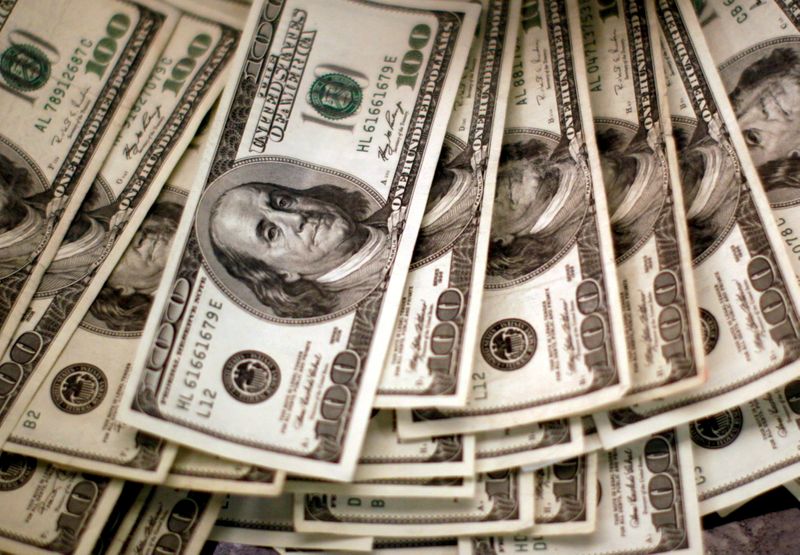 Dollar bides time below two-month highs before payrolls test