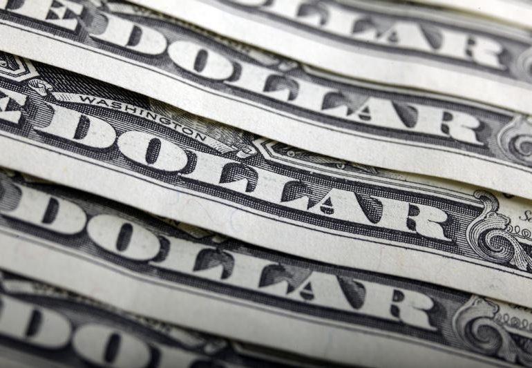 Dollar Slips After Powell's Dovish Tapering Comments By Investing.com