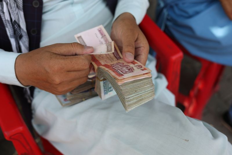 Running out of dollars, Afghan banks ask Taliban for more cash