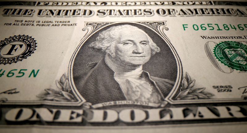 Dollar wallows near one-month low as strong euro, stock rally weigh