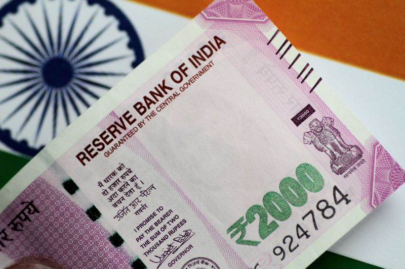 India rupee at 3-week low, yields fall on new COVID variant concerns