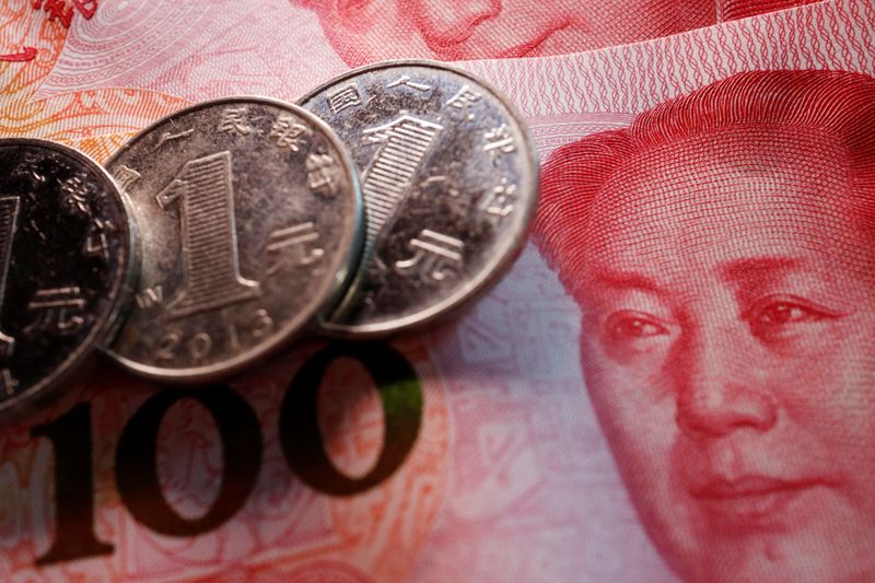 Investment banks rush to cut yuan forecasts again after April revisions